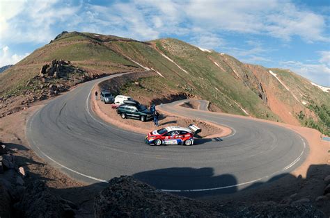 Pikes peak hill climb - The Pikes Peak International Hillclimb began in 1916 when the Pikes Peak carriageway was widened and renamed the Pikes Peak Highway. The course was fully gravel and very technical, 12.4 miles ...